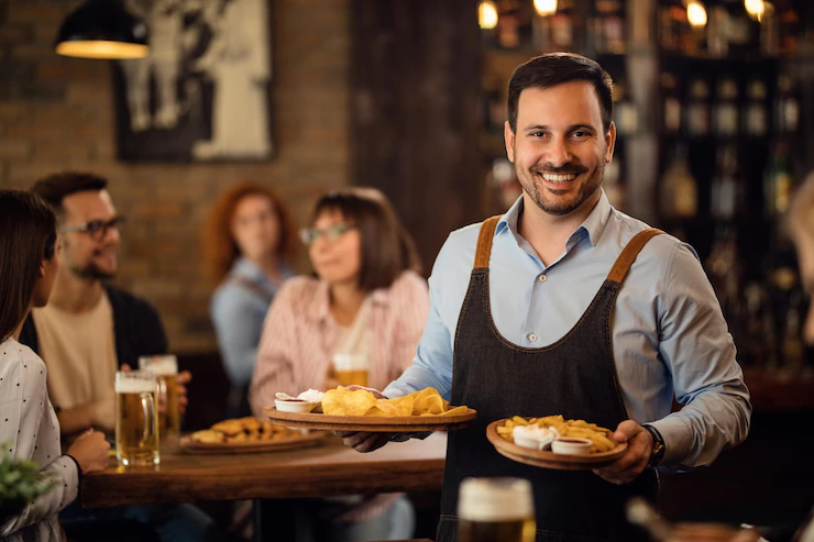Happy Waiter Serving Guests Restaurant