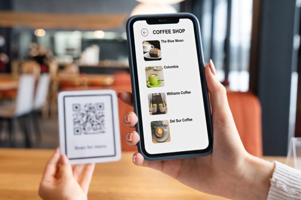close-up-hands-holding-smartphone-qr-code-3.jpg