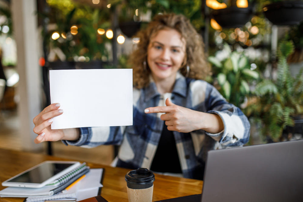 A woman holding a restaurant survey paper
