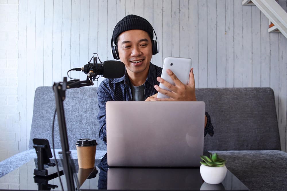 A man posting his podcast to social media channels