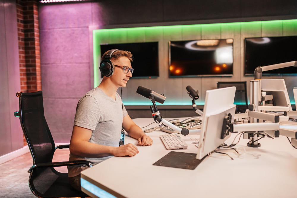 A man setting up a podcast