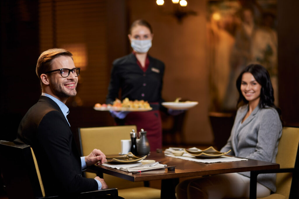 Couple eat at fine dining restaurant