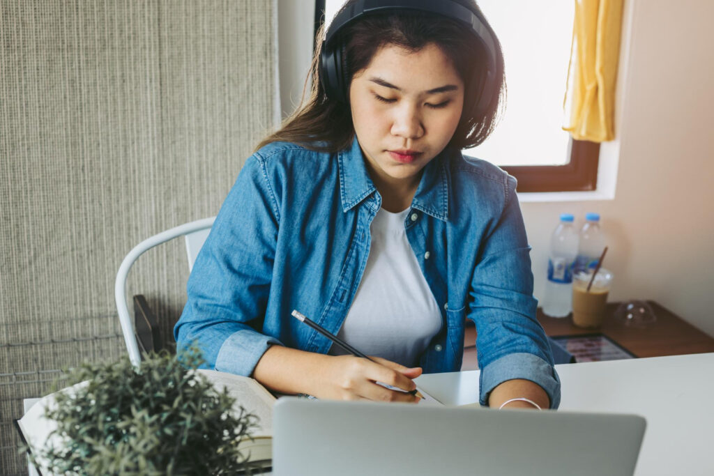 A woman doing test online with laptop from home