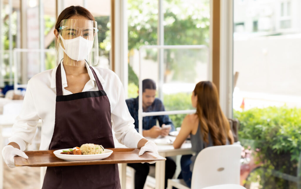 A waitress serving food in the restaurant