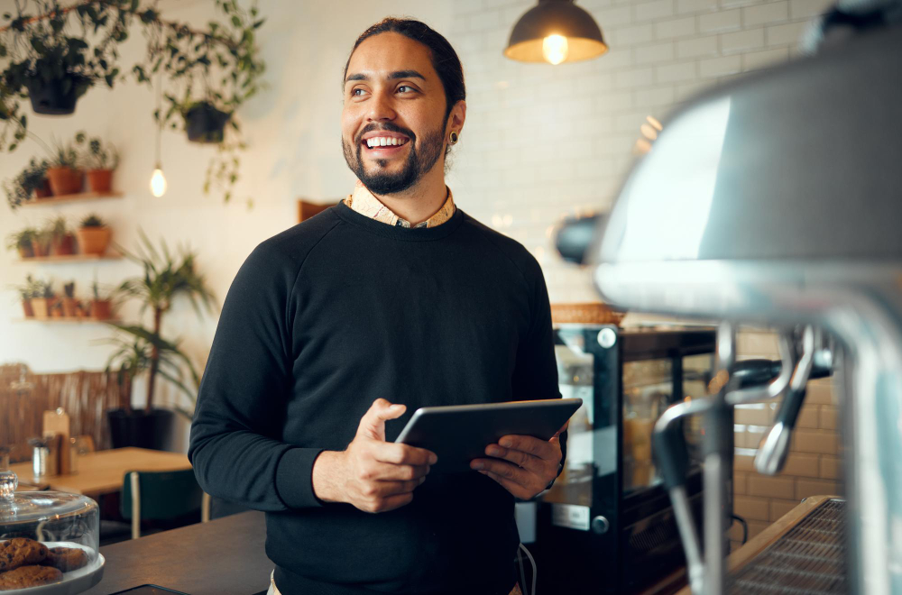 A smiling restaurant manager