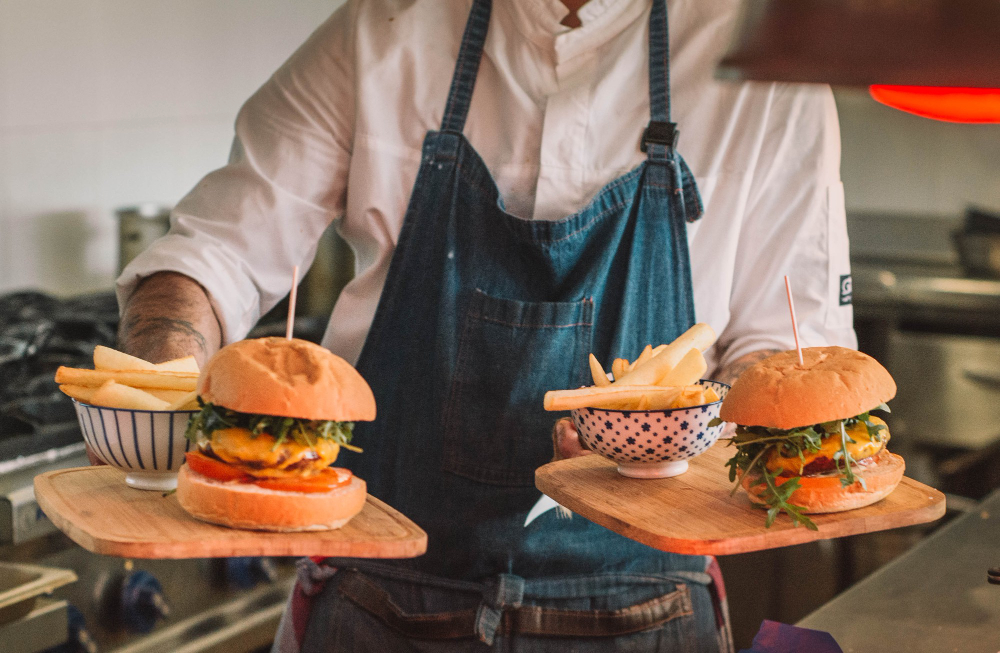 Serving beef burgers