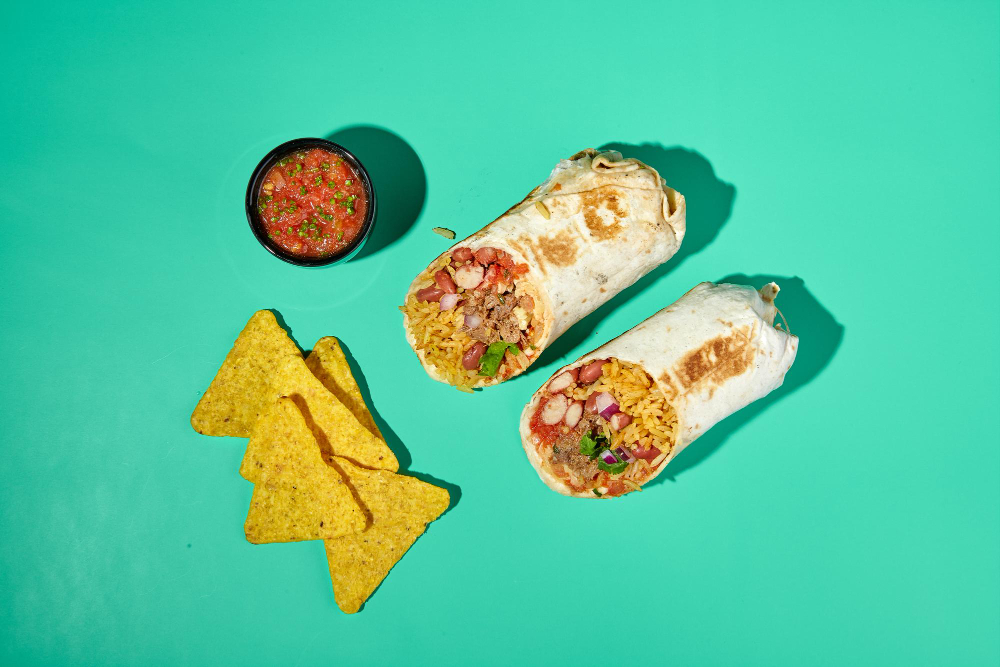 Traditional Mexican Beef Burrito with Nachos Chips and Salsa Sauce